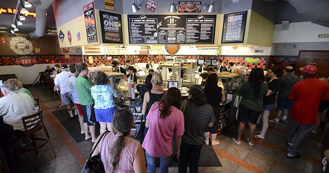 Patrons fill the old Jimmy Johns restaurant on July 19, 2012 for customer appreciation day. Jimmy Johns moved next to Kent Stage on Main St. and the old building was demolished on Monday, Nov. 12. Photo by Matt Hafley.