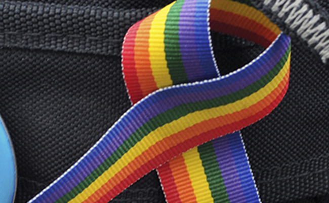 Brandon Stephens displays a rainbow ribbon on his backpack with pride. Stephens encourages LGBTQ members to educate others that they are just like everyone else.. Photo by Jessica Denton.