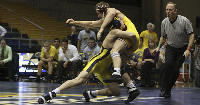 149+lb.+Freshman+Ian+Miller+takes+down+his+Central+Michigan+opponent+during+the+meet+on+Jan.+29.+Kent+State+beat+Central+Michigan+22-13+to+remain+unbeaten+in+the+Mid-American+Conference.+Photo+by+COTY+GIANNELLI.