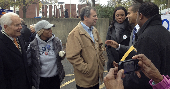 Sherrod Brown and actress Aisha Tyler speak to voters in Akron. Photo by Rex Santus.