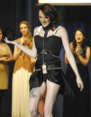 Rianna Ramey walks the runway after being announced as best in show for modeling an outfit designed by Kate Demay, from her collection inspired by France at the Art of Contrast Fashion Show in the ballroom on Friday, Nov. 17. Photo by Jenna Watson
