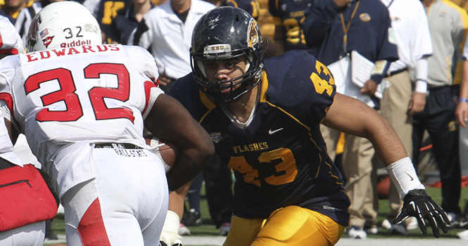Kent State linebacker C.J. Malauulu is about to tackle a Ball State player at the Sept. 29 game at Dix Stadium. Photo by Brian Smith.