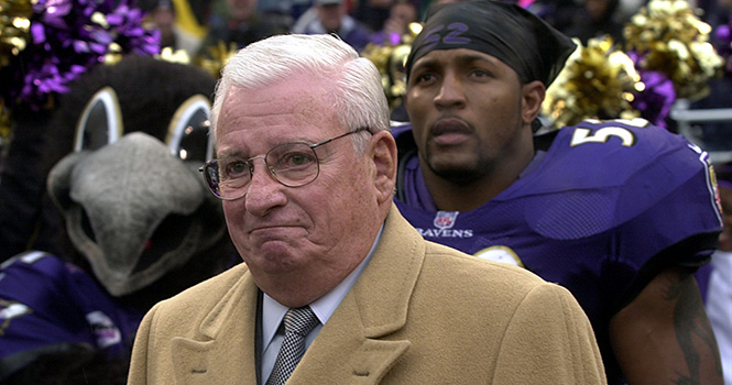 Baltimore Ravens owner Art Modell is escorted onto the field by linebacker Ray Lewis (52) before the Ravens faced San Diego Sunday, December 10, 2000. Photo by George Bridges/KRT.