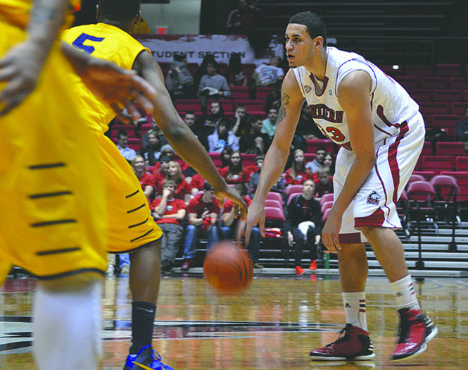 Northern Illinois sophomore Abdel Nader dribbles the ball during the game against Kent State on Wednesday night. The Flashes lost with a final score of 67-65. Photo courtesy of Amy Chow of the Northern Star.