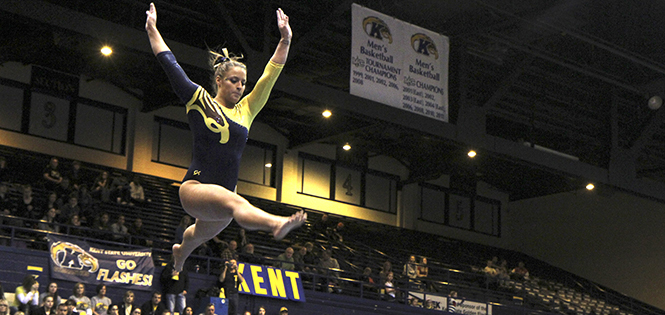 Junior Marie Case performs a split jump on the balance beam during a 196.050-194.900 home win over Central Michigan Friday, Feb. 15. Photo by Shane Flanigan .