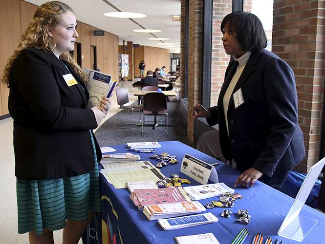 History major Haley Richardson, 20, talks with Sharon Allen, a recruiter for the Cleveland Public Library, on March 1 at the Job and Internship Fair held on the second floor of the Student Center. Richardson says, I would love to be able to find a job when I graduate in May. Photo by Adrianne Bastas.