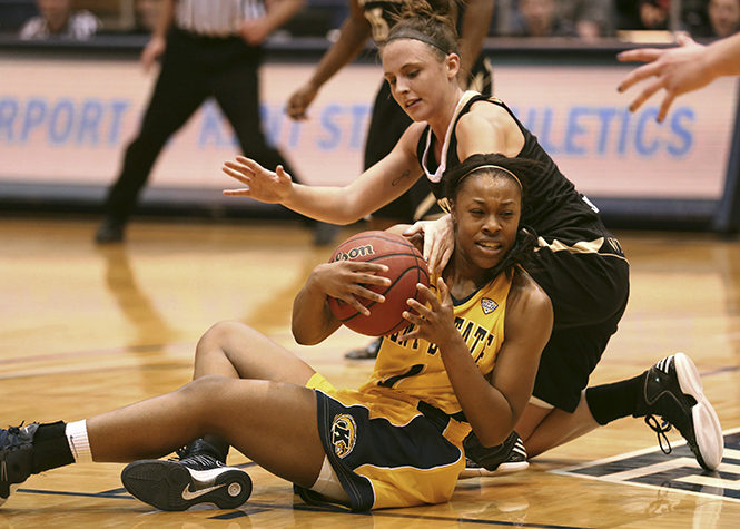 Freshman Ashley Evans keeps the keeps a loose ball from Western Michigan guard A.J. Johnson in the MAC Center on Feb. 7. The Lady Flashes fell to the Broncos 40-58. Photo by Brian Smith.