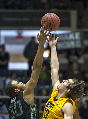 Ohios Reggie Keely narrowly wins the tip off against Kent States Mark Henniger at the Convocation Center in Athens, Ohio on Saturday, Feb. 16. The Flashes lost to The Bobcats in overtime, 78-75. (Jason E. Chow