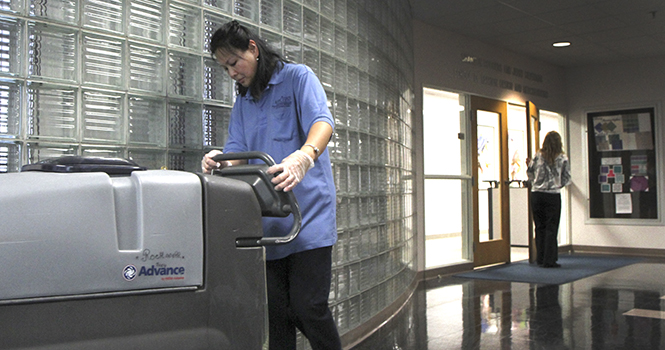 Beth Causey, 43, custodian at Kent State, operates a floor scrubber in Rockwell Hall Wednesday, Jan. 30. Causey has worked for the universitys custodial services for five years. Photo by Shane Flanigan.