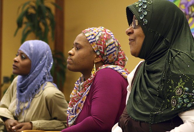 Guest Speakers Amra Abdullah (right), Sajdah Habeeb (middle), and Naimah Epps (left) answer questions about their practices during their discussion on women of Islam who identify as Muslim in the Multicultural Center on Wednesday February 20th 2013.. Photo by Emily Lambillotte.
