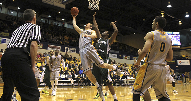 Junior forward Mark Henniger goes for a layup during a 77-62 home victory over Eastern Michigan Saturday, Feb. 2. Kent State improved to 12-10 on the season and 3-5 in the MAC. Photo by Shane Flanigan.