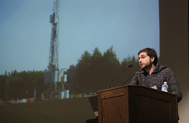 Bulgarian journalist Dimiter Kenarov speaks at the Fracking Forum in the KIVA on Feb. 20. Kenarov, who has written for Esquire and The International Herald Tribune, spoke about how the process of fracking affected people from Poland to Ohio. Photo by Brian Smith.