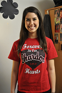 Morgan Rowe, freshman fashion merchandizing major, shows her shirt she recieved at Chardon High school after last years shooting. Rowe was a senior at Chardon in February 2012, and was in the cafeteria when the shooting. Photo by Jessica Denton