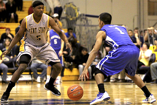 Sophomore guard Eric Gaines guards junior guard Tony Watson on Feb. 14, 2012 The Flashes defeated the Bulls 76 to 71. Photo by Adrianne Bastas.