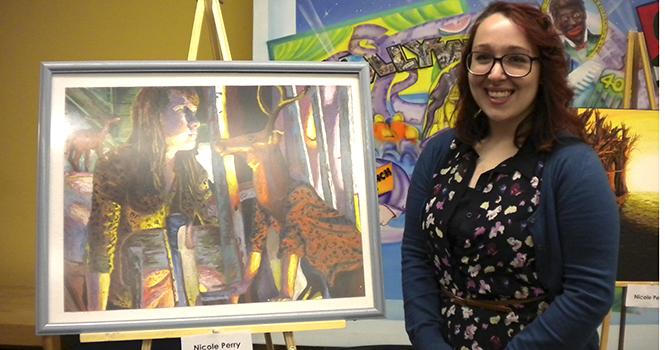 Nicole Perry with her winning painting New Chair. Photo courtesy of Kelsey Leyva.
