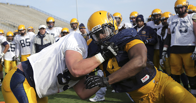 Kent+State+football+players+go+through+drills+at+Dix+Stadium+on+April+8%2C+2013+during+the+forth+spring+practice.+Photo+by+Brian+Smith.