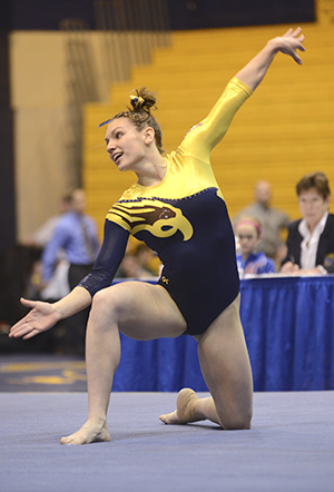 Senior Lauren Wozniak performs her floor routine at the first ever Beauty and the Beast competition on Feb. 8, 2013. The lady Flashes defeated Rutgers with a final score of 195.675-193.700. Photo by Jenna Watson.