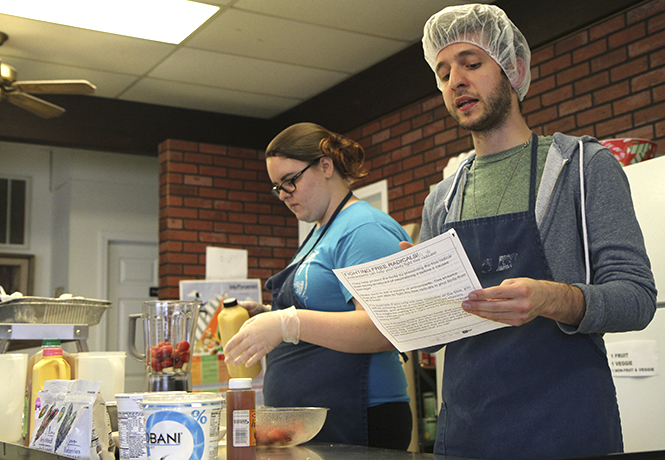 Graduate student Rocco Russo teaches attendees at Kent Social Services about the benefits of antioxidants on Friday, April 12 as part of Kent States Nutrition Outreach Program. Photo by Shane Flanigan.