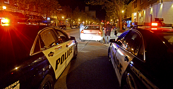 Two Kent City police officers make a traffic stop on South Water St. in the early hours of May 4, 2013. Photo by Matt Hafley