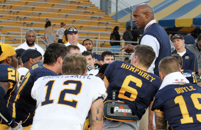 Head Coach Paul Haynes speaks to the football team at the conclusion of the annual Spring Football game on Saturday, April 27 at Dix Stadium. The Blue overwhelmed the Gold, defeating them 31-0 in the exhibition game. Photo by Shane Flanigan