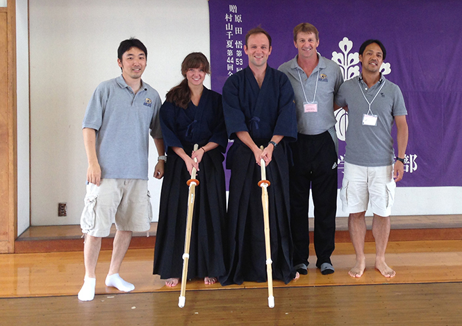 Photo by Takahiro Sato, Kathryn Damicone, Collin Epstein, Stephen Mitchell, Tsuyoshi Matsumoto, Associate professor at the University of Tsukuba. Damincone and Epstein are in the traditional clothing for the sport of Kendo.