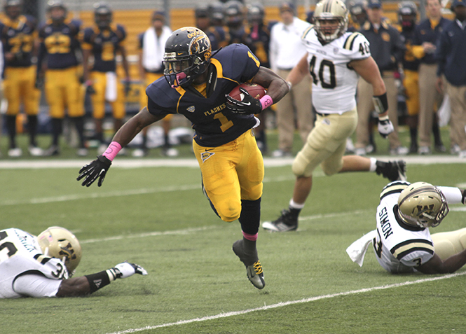 Kent State running back Dri Archer weaves his way through the Western Michigan defense during last years Homecoming Game in Dix Stadium on Oct. 20, 2012. The Flashes won the game against the Broncos 41-24. Photo by Brian Smith.