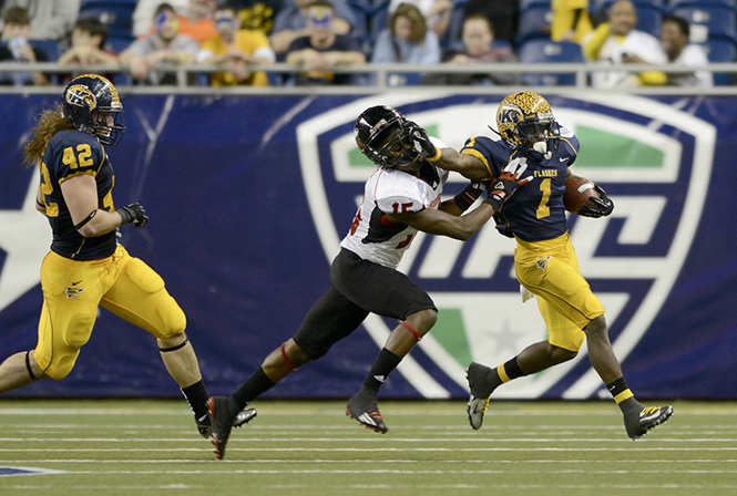 Senior running back Dri Archer (right) is pushed out of bounds during the MAC Championship game on Nov. 30, 2012. Photo by Matt Hafley.