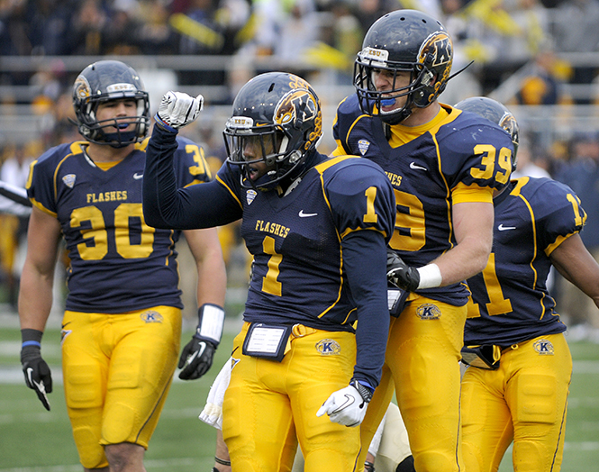Senior running back Dri Archer celebrates with teammates after a successful tackle during the first half of Kent State's Homecoming game on Oct. 18, 2012. The Flashes triumphed over the Broncos 41-24.. Photo by Hannah Potes .
