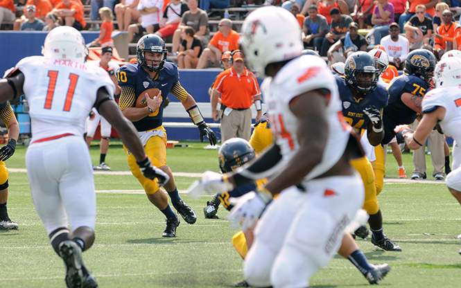 Red Shirt freshman quarterback Colin Reardon runs the ball in the game against Bowling Green on Saturday, September 7. The Flashes lost 22-41. Photo by Rachael Le Goubin.