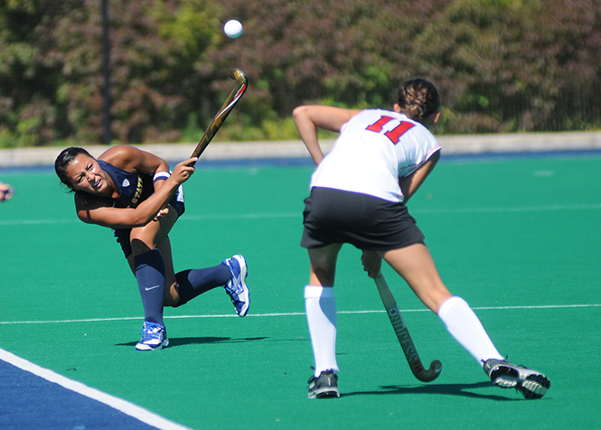Sophomore midfielder Alayna Harris makes a pass at the field hockey game against Ohio State on Tuesday, Sept. 24, 2013. The Flashes lost 3-4.. Photo by Rachel Le Goubin.
