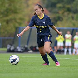 Midfielder Madison Helterbran kicks the ball down the field during the game against Bowling Green on Sunday Sept. 29, 2013. The Flashes won the game, 5-1. Photo by Jenna Watson.