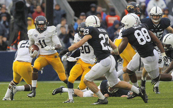 Kent State wide receiver James Brook tries to avoid being tackled by the Penn State defensive line during Saturdays game. Kent State lost the game to Penn State 34-0. Photo by Melanie Nesteruk.