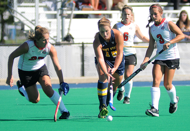 Junior midfielder Abbie Carrico wards off opponents at the field hockey game against Ohio State on Tuesday, Sept. 24, 2013. The Flashes lost 3-4. Photo by Rachael Le Goubin.