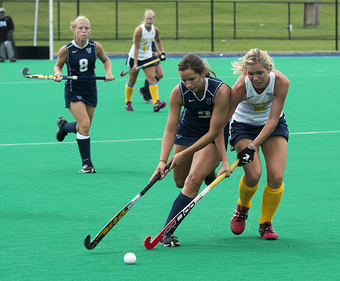 Sabrina+Binder+tries+to+get+the+puck+back+from+Villanova+opponent+on+Sept.+15%3B+2013.+Kent+State+won+the+game+4-1.+Photo+by+Abby+Schafer.