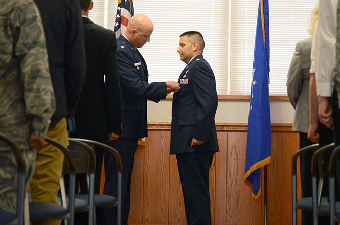 Major+Daniel+E.+Finkelstein%2C+professor+of+aerospace+studies+for+AFROTC%2C+recieves+his+pin+at+his+promotional+ceremony+Tuesday%2C+Sept.+3+from+James+D.+Hunsicker.+Major+Finkelstein+was+promoted+to+Lieutenant+Colonel.+Photo+by+Leah+Klafcznski.
