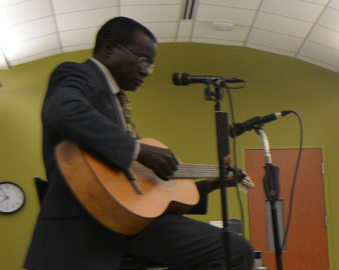 Dr. Alphonse Ndiaye, a visiting Senegalese scholar, sings an original Senegalese song and plays guitar as part of a lecture in Oscar Ritchie Hall Thurs., Oct. 24. Photo by Jacob Byk.