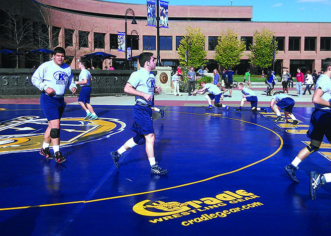 Wrestlers practise in Risman Plaza on Monday, Oct. 14, 2013. Photo by Time Dorst.
