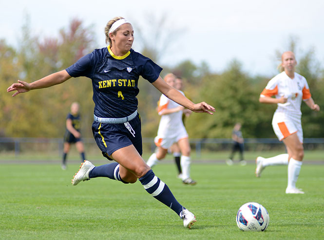 Senior forward Jessacca Gironda drives the ball for Kent State Sept. 29, 2013, against Bowling Green. Gironda earned a hat trick, leading the Flashes to a winning score of 5-1. Photo by Jenna Watson.