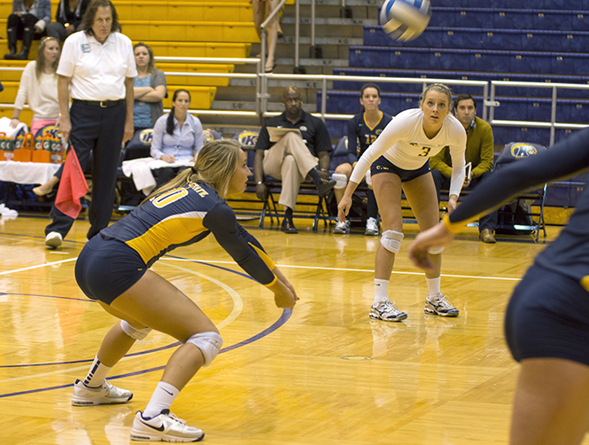 Sophomore defensive specialist Sarah Mills (left) bumps to set up a perfect spike Saturday, August 21, 2013. Kent State will play at Youngstown State Tuesday, Oct. 1, 2013. Photo by Abby Schafer.