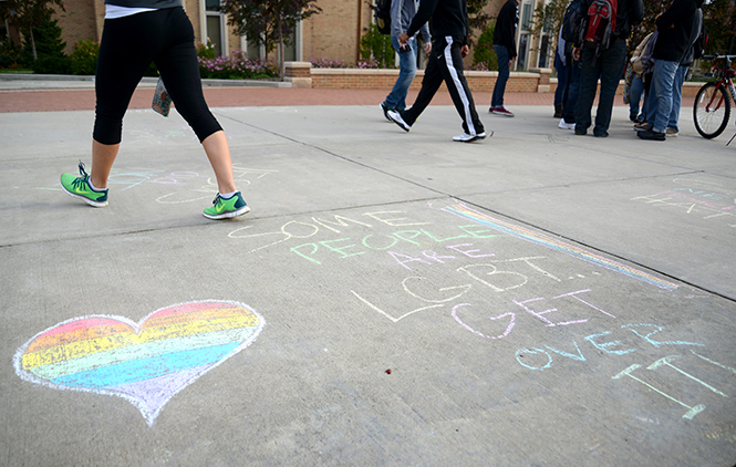 Chalk messages covered Risman Plaza as a protest to a demonstration outside University Library condemning homosexuality and abortion on Tuesday, Oct. 29, 2013. The chalkings were a combination of facts about abortion and the LGBT community, as well as rebuttles to the demonstrations messages. Photo by Jenna Watson.