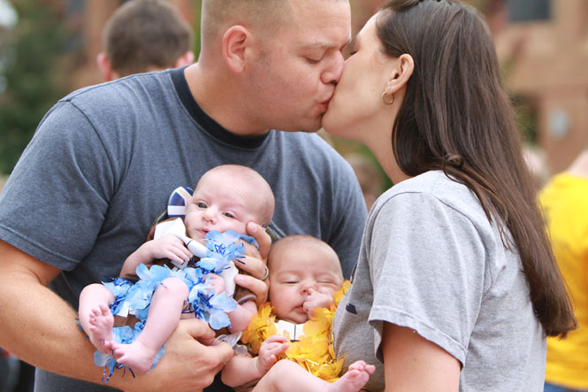 Katie Bowen and Lucas Bowen kiss at the Risman Plaza on Saturday Oct. 5, 2013. Katie graduated from Kent State in 2007, Lucas graduated from Kent State in 2010. Their twin babies are ten weeks old. Photo by Yolanda Li