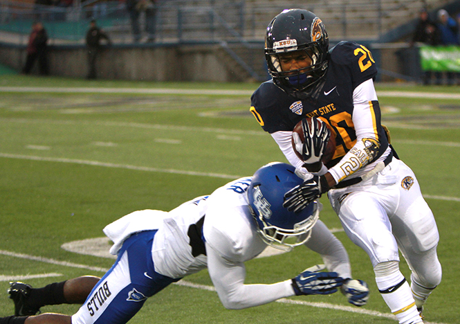 Freshman wide receiver Ernest Calhoun holds off a player from the Buffalo Bulls on Oct. 26, 2013 in Dix Stadium. The Golden Flashes lost the game 41-21. Photo by Chloe Hackathorn.