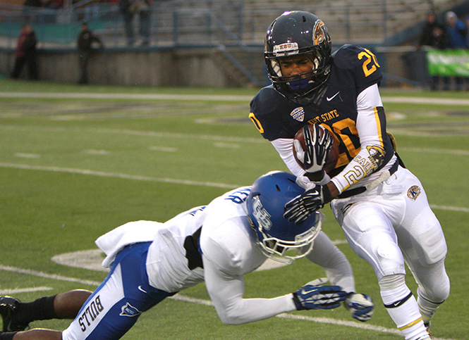 Freshman wide receiver Ernest Calhoun (right) runs the ball against the Buffalo Bulls on Oct. 26, 2013. The Golden Flashes lost 41-21. Photo by Chloe Hackathorn.