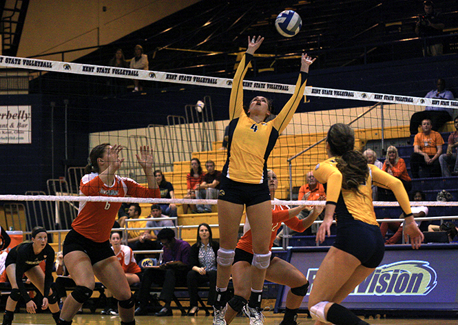 Kent State senior Aleksandra Nowak sets the ball to her teammates during a game against Bowling Green State University on Friday, Oct. 4, 2013. Kent State fell to the Falcons 1-3. Photo by Emily Lambillotte.