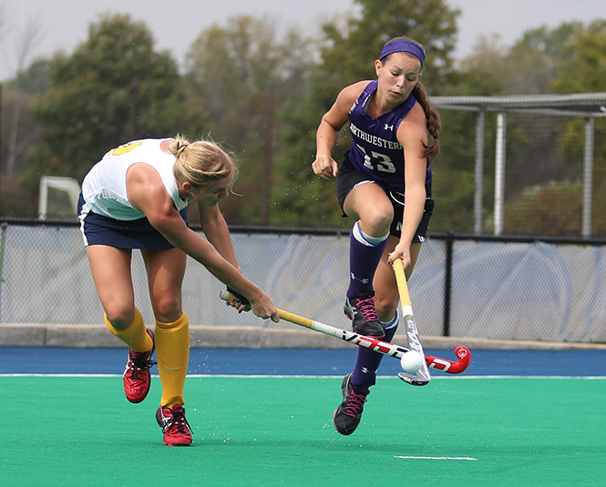 Senior Sabrina Binder defends against an attempted goal during the Flashes game against Northwestern University on Sunday Oct. 6, 2013. The Flashes lost 3-1. Photo by Coty Giannelli.