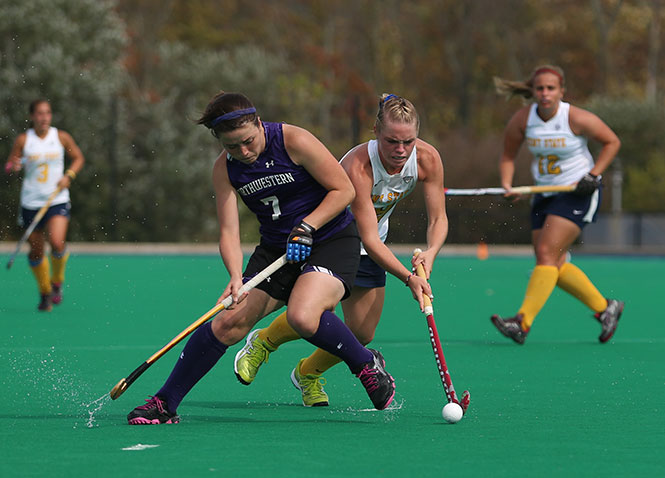 Freshman Madison Thompson (right) tries to dribble past an opponent on her way down the field during the Flashes’ game on Sunday, Oct. 6, 2013. The Flashes were unable to pull off a victory, losing 3-1. Photo by Coty Giannelli.