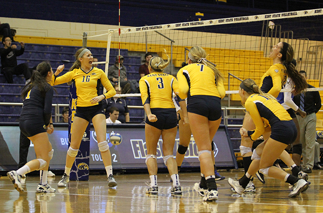 Members+of+the+Kent+State+volleyball+team+celebrate+after+scoring+a+point+against+Buffalo+on+Friday%2C+Nov.+1%2C+2013.+Photo+by+Erin+McLaughlin.