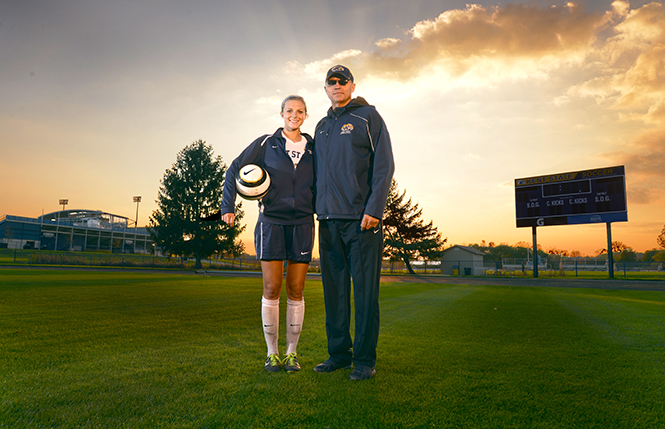 Kent+State+freshman+soccer+player+Abbie+Lawson+stands+with+her+father+Kent+State+track+and+field+coach+Bill+Lawson.+%E2%80%9CIt%E2%80%99s+always+the+one-upsmanship+or+who+did+what+better+or+always+making+comparisons%E2%80%9D+Bill+said.+%E2%80%9CShe+absolutely+hates+to+lose+at+anything%2C+but+I+guess+that%E2%80%99s+me+looking+in+the+mirror.%E2%80%9D+Photo+by+Leah+Klafczynski.