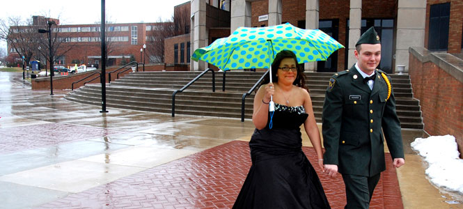 The rain did not stop students Cathy Howard and John Richards from attending the ROTC ball Friday. Photo by Jackie Friedman.