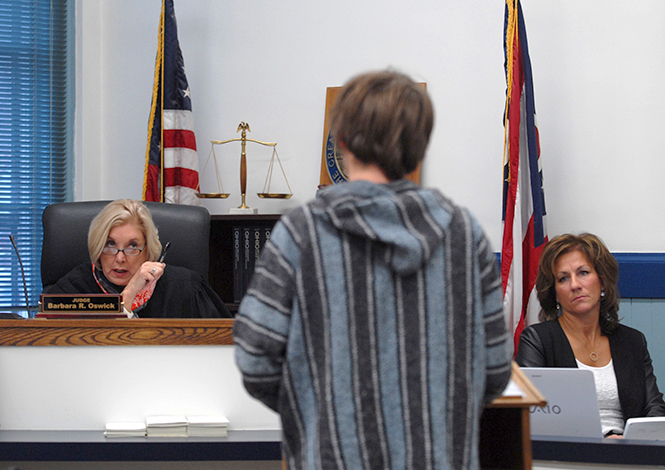 udge Barbara Oswick addresses a young man in the Kent Municipal Court after his spending an evening in the Kent jail. The arraignment was called due to failure to complete the alcohol diversion program. Photo by Jacob Byk.